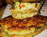 A picture of step 14 of Roti ke double layer tringle shape pizza.