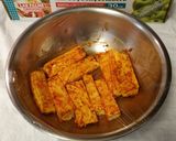A picture of step 3 of Paneer wrapped in banana leaf.