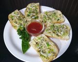 A picture of step 3 of Herb chilli garlic bread.