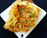 A picture of step 12 of Jollof Vegetable noodles with fried eggs.
