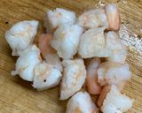 A picture of step 2 of Scrambled egg with shrimp on rice.