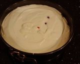 A picture of step 11 of White Chocolate Cherry Truffle Cheesecake.