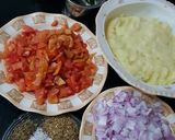 A picture of step 1 of Dam allu with colourful zeera rice.