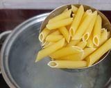 A picture of step 1 of Cheesy and Creamy veggie white sauce penne pasta (with fresh cream, cheese and seasonings).