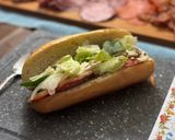 A picture of step 3 of Subway at home/ sub board.