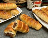 A picture of step 13 of Nutella stuffed caterpillar buns.