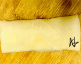 A picture of step 2 of Chicken spring roll wrappers.