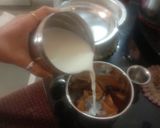 A picture of step 2 of Chikoo shake with rose petals.