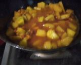 A picture of step 3 of Green papaya with black chana and potatoes.