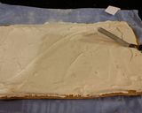 A picture of step 22 of Carrot Cake Roll with Whipped Cinnamon Cream Cheese Filling and Frosting.