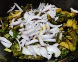 A picture of step 5 of Runner beans and potato fry with onion and onion greens.