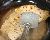 A picture of step 6 of Omelette-roti sandwich.