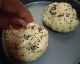 A picture of step 5 of Pretzel bread buns filled tomato kootu.