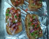A picture of step 4 of Homemade multigrain bread sooji pizza.