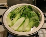 A picture of step 4 of Braised Chinese Pork Belly w Pak choi served with boiled rice.