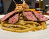A picture of step 6 of Surf n’ Turf over Garlic Basil Fettuccine.