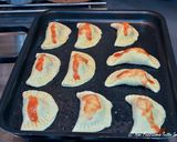 A picture of step 5 of Mini Calzones with Sausage and Cheese Filling.