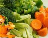 A picture of step 2 of Multi colored pilaf with broccoli, red and orange bell peppers, and carrots.
