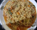 A picture of step 2 of Spicy maggie with lots of veggies.