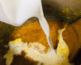 A picture of step 2 of Dal Masoor cooked with milk.