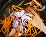 A picture of step 2 of Sausage Carrots Mixed Pepper stir fry.
