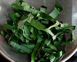 A picture of step 1 of Chingri diye kochu shaak.