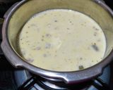 A picture of step 3 of Doodh daliya in pressure cooker (with different toppings).