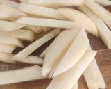 A picture of step 2 of Peri peri French fries.