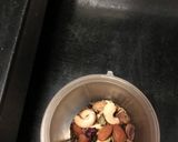 A picture of step 2 of Thandai with rose petals.