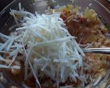 A picture of step 5 of Sig's Tomato and potato mash filled potato boats.
