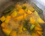 A picture of step 2 of Pumpkin Drumstick curry.