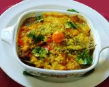 A picture of step 6 of Drum stick tomato masala curry (sambar) mixed with rice.