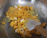 A picture of step 3 of Mango Blondie Bars with M&Ms.