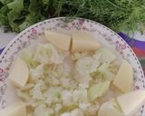 A picture of step 1 of Cauliflower and potato with green touch.