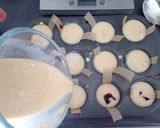 A picture of step 5 of Jam-Doughnut Mini Muffins.