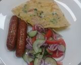 A picture of step 9 of Spanish Omellette, deep fried sausages n cucumber onions salad.