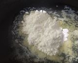 A picture of step 3 of Pasta in white sauce with garlic bread.