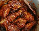 A picture of step 5 of Honey and ketchup glanced chicken drumsticks.