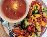 A picture of step 5 of Tomato Soup with sauteed garlic vegetables.