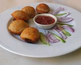 A picture of step 5 of Spicy appam stuffed with masala potato.