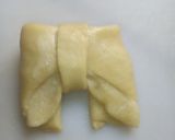 A picture of step 14 of Bow tie buns.