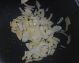 A picture of step 2 of Μπάμιες/Bamies--Greek style braised okra with tomatoes.