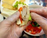 Hình bước làm 3 của món Món cuốn hành trần Thủy Nguyên với hoa ban tím