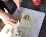 A picture of step 2 of Goat cheese & jam crackers.