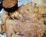 A picture of step 5 of Owar cheese pizza dosa with tomato onion chutney gravy.