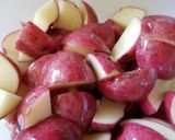 A picture of step 3 of Rosemary & Garlic Red skin potatos.