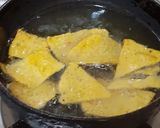 A picture of step 4 of Doritos (nachos chips) in cheese sauce.