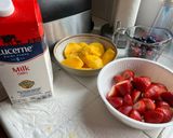 A picture of step 1 of Strawberry Blueberry Mango Milkshake.