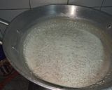 A picture of step 12 of Dodha Burfi with Daliya.