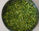 A picture of step 1 of Gawar aani Batata Upkari.